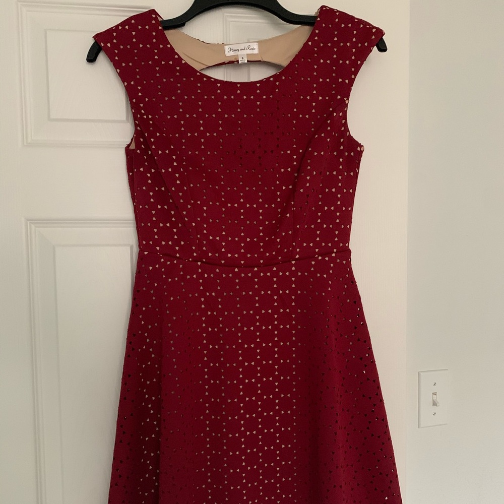 Dillard’s Mid-length red formal dress.